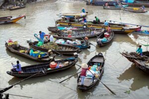 Boat vendors at the Cai Rang floating market in Can Tho on the Mekong Delta