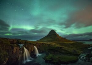 Aurora Borealis activity on top of Kirkjufell mountain, Iceland