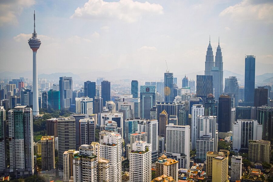 The Kuala Lumpur skyline at dusk with skyscrapers