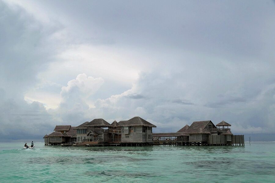 An overwater stilt villa at a luxury resort in the Maldives