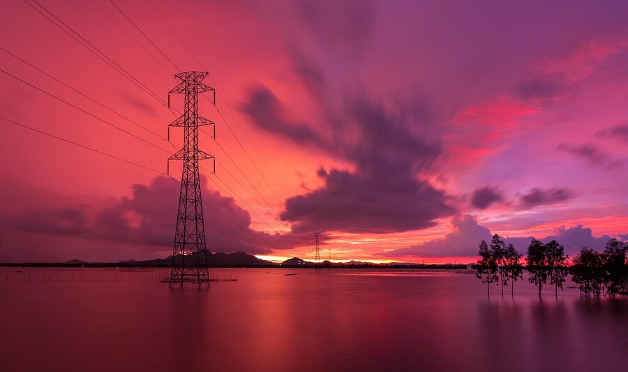 A sunset over a flooded river in the Mekong Delta during the wet season