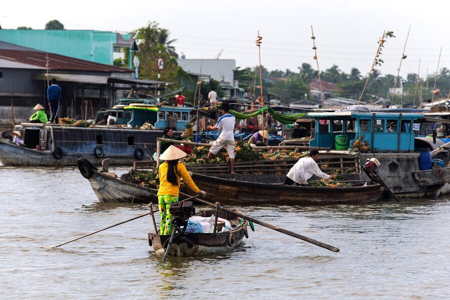 Boats laden with produce trading on the Mekong Delta floating market