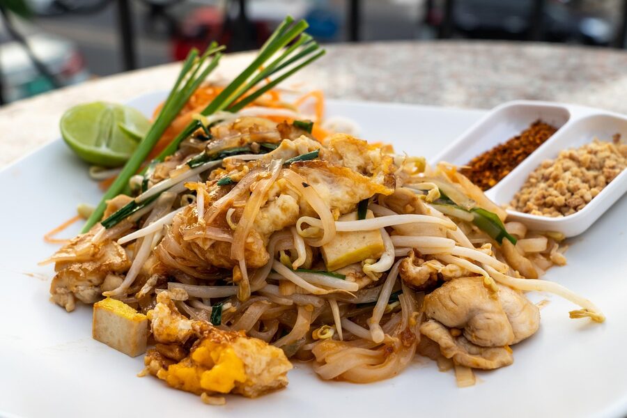 A plate of pad thai, the Thai noodle dish with shrimp and lime