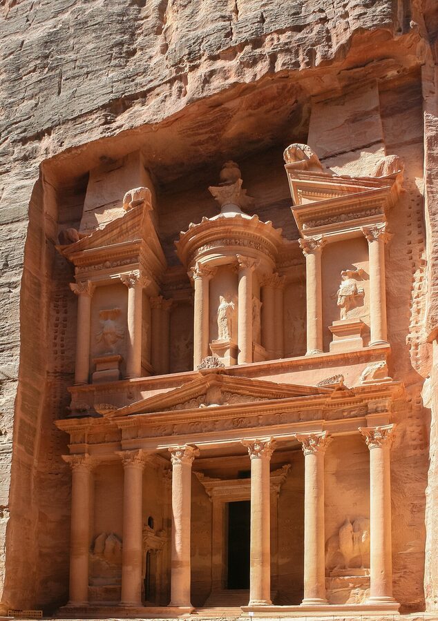 The carved facade of the Treasury at Petra, Jordan, viewed through the Siq
