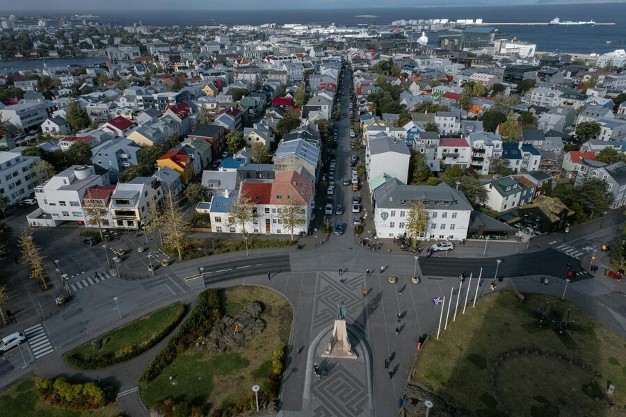 Panoramic aerial view of Reykjavik with colourful houses and streets under a clear sky