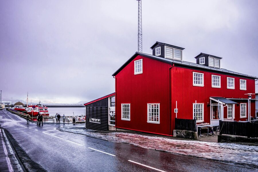 A red building in Reykjavik by the harbour during winter