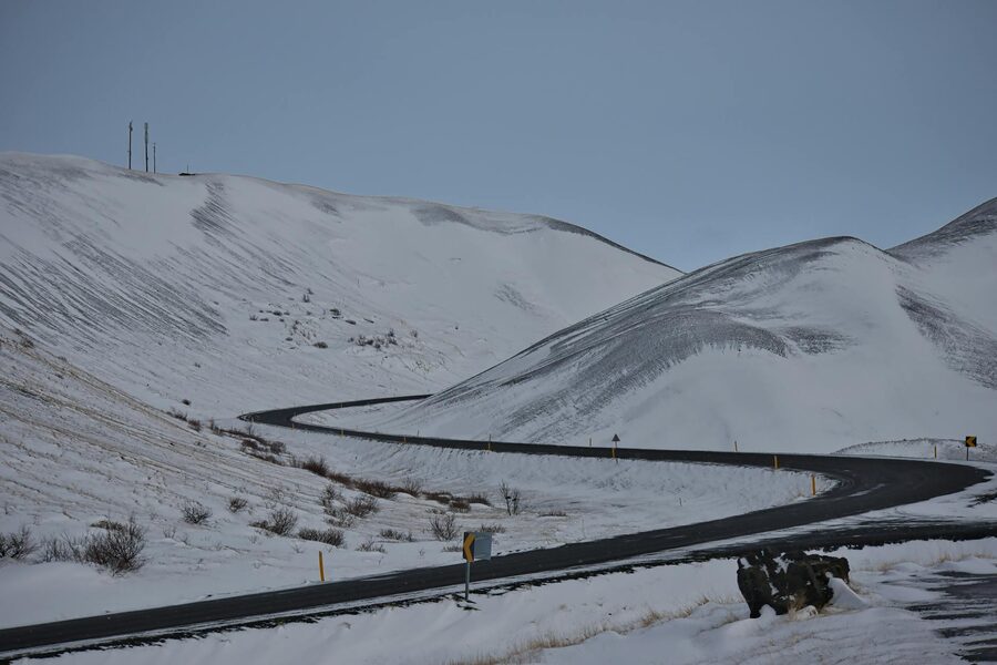 Remote snow-covered mountain road in Iceland