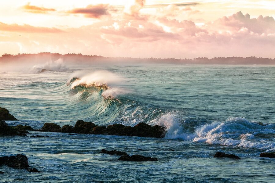 Waves on a tropical beach at sunset