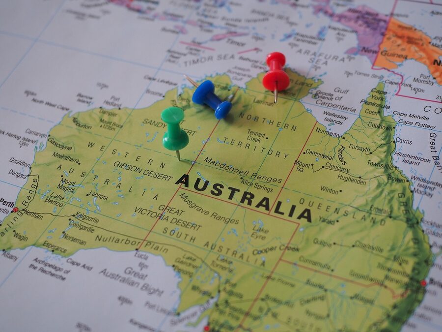 A world map with pins marking travel destinations