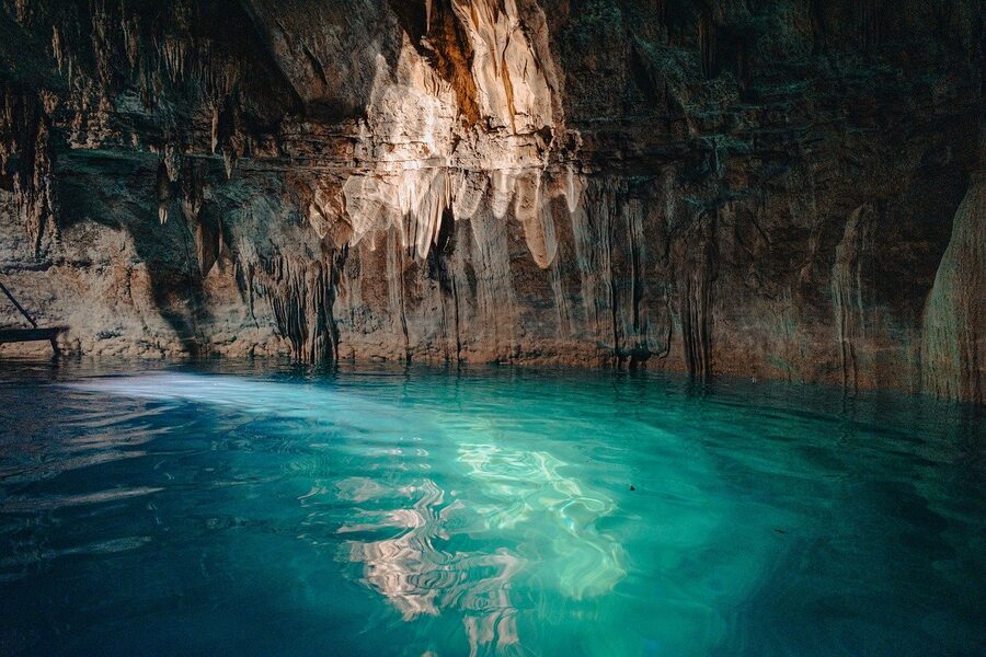 A cenote inside a cave in the Yucatan with clear water